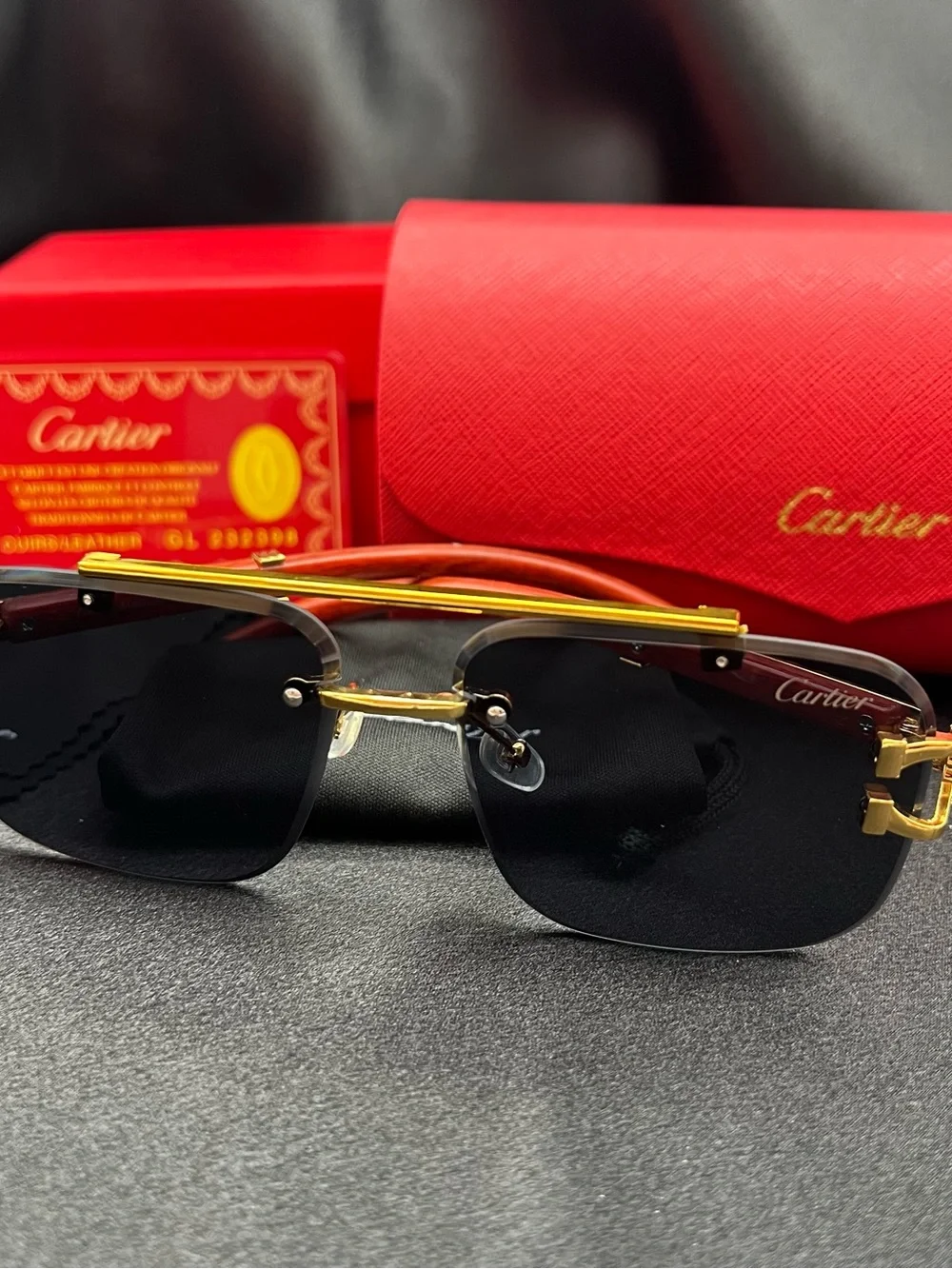 Cartier Men’s Black and Gold Rimless Sunglasses